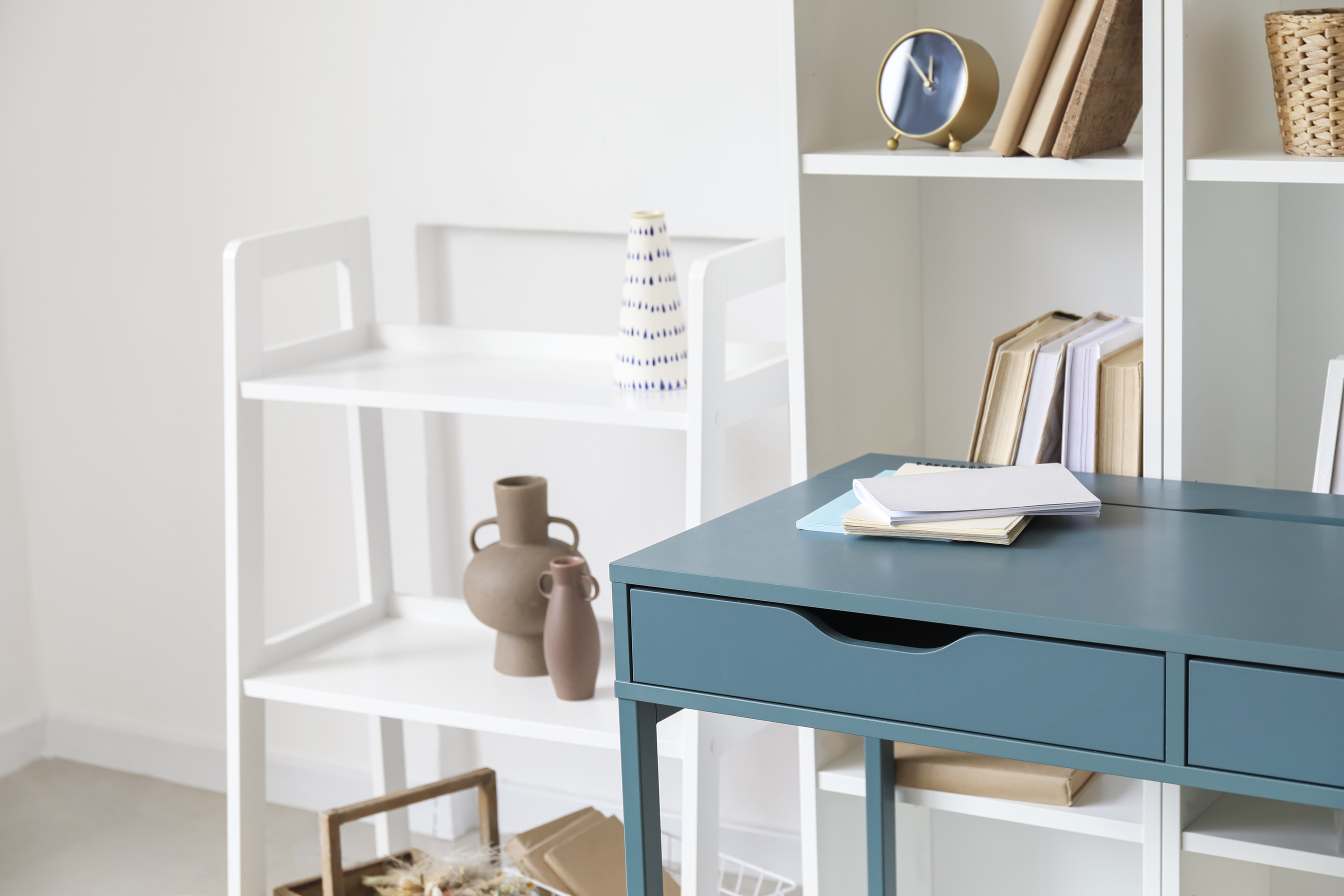 Blue Desk near Bookcase in Room