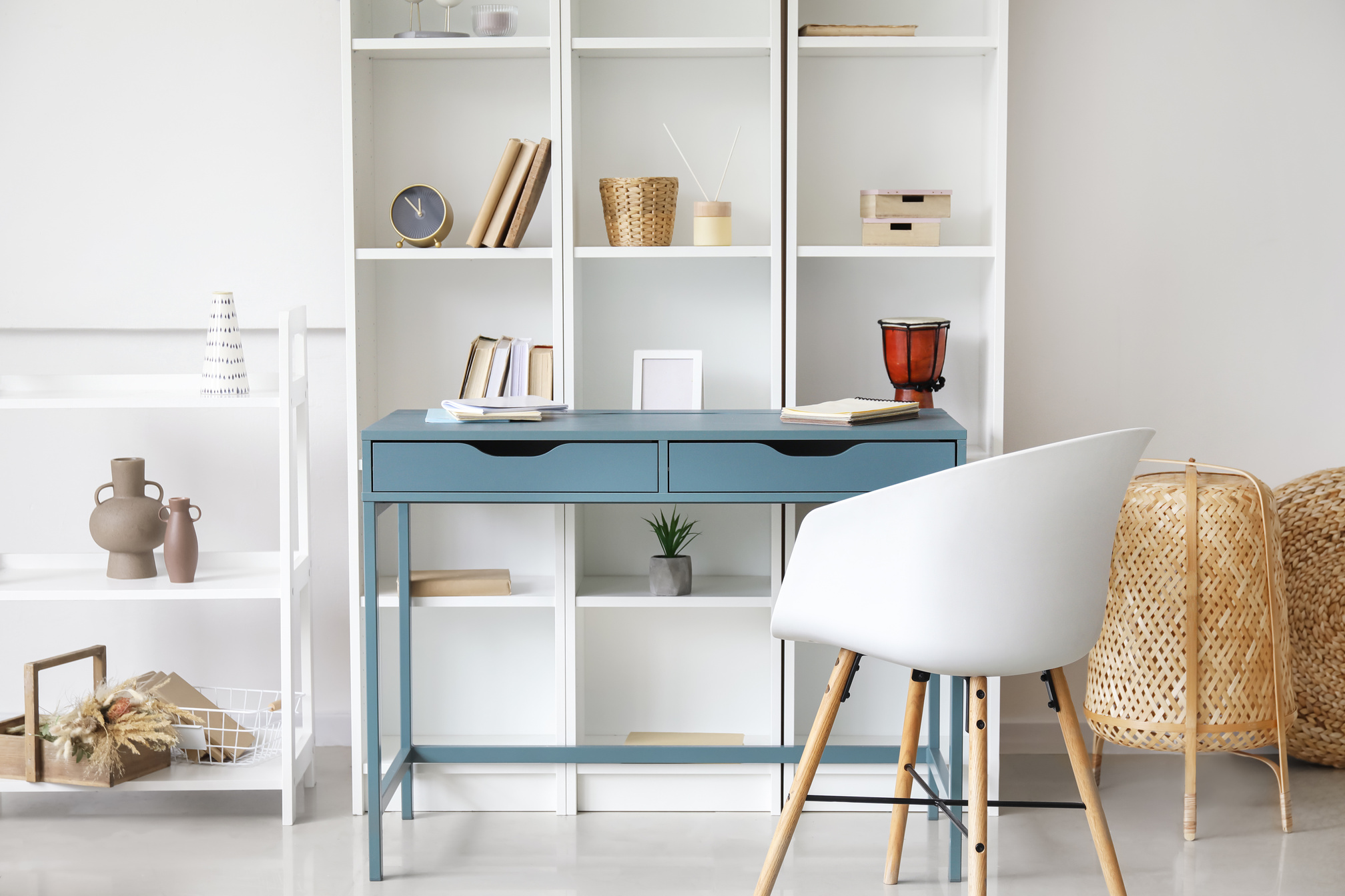 Blue Desk near Bookcase in Room